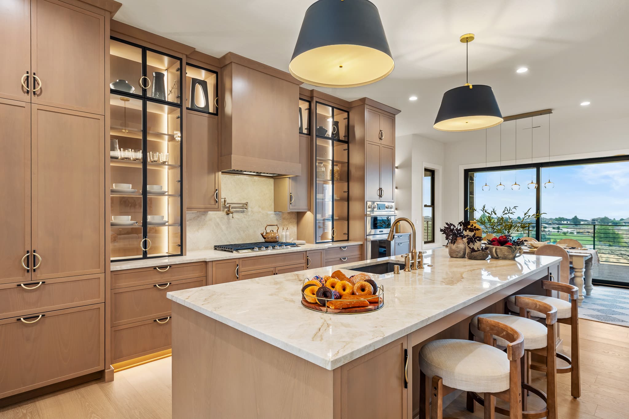 Dark walnut kitchen cabinets with soapstone backsplash