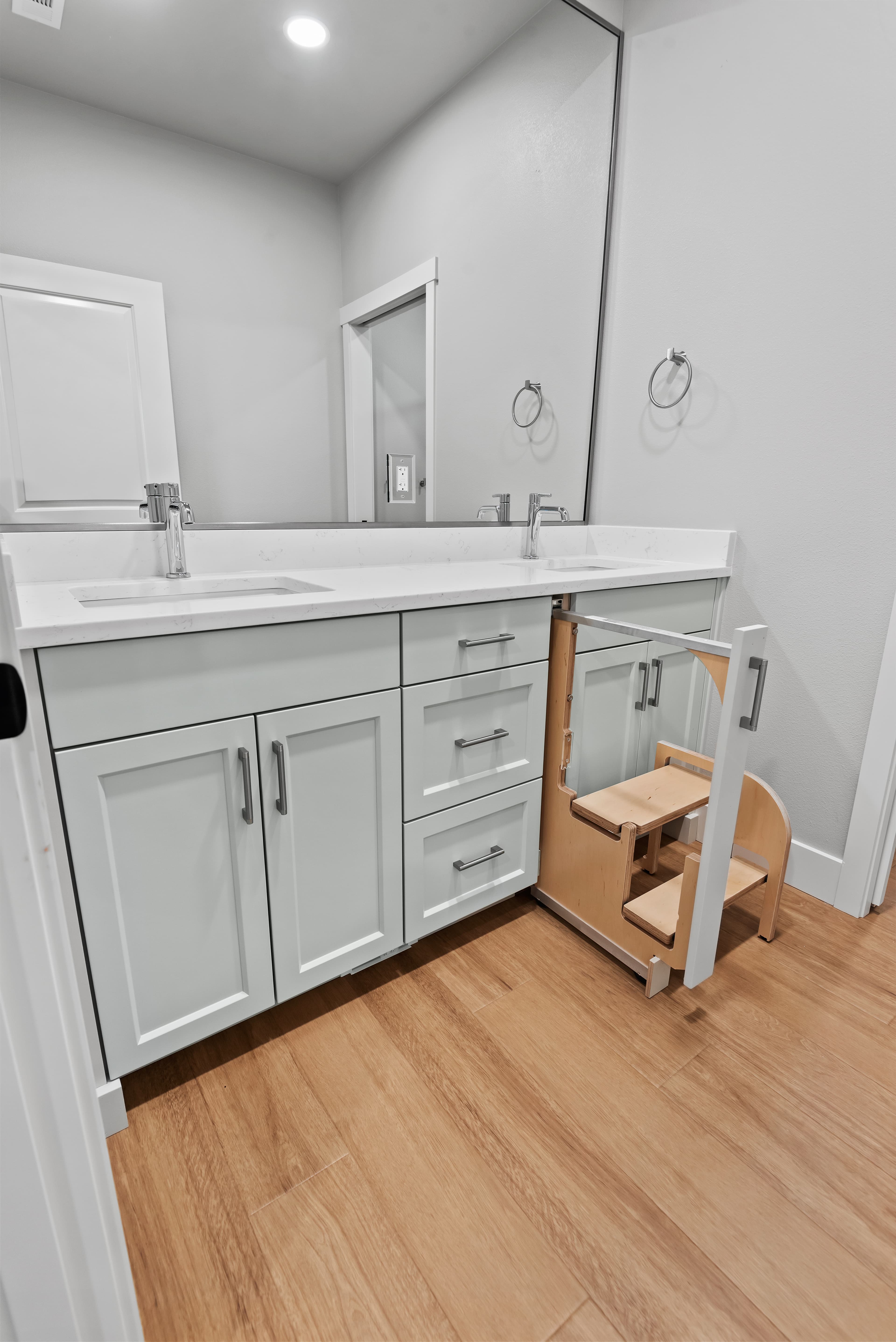 Bathroom vanity with pull-out step stool detail